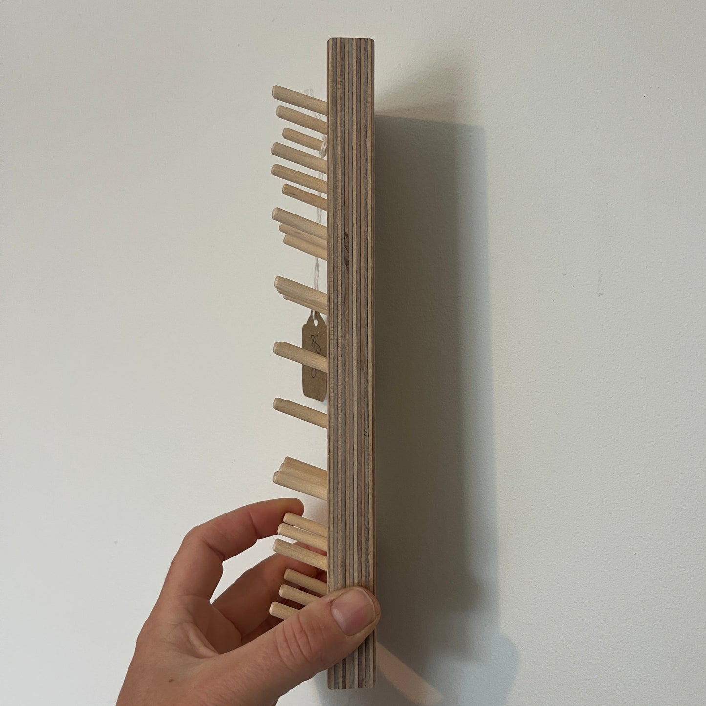 Side view of a bobbin pegboard
