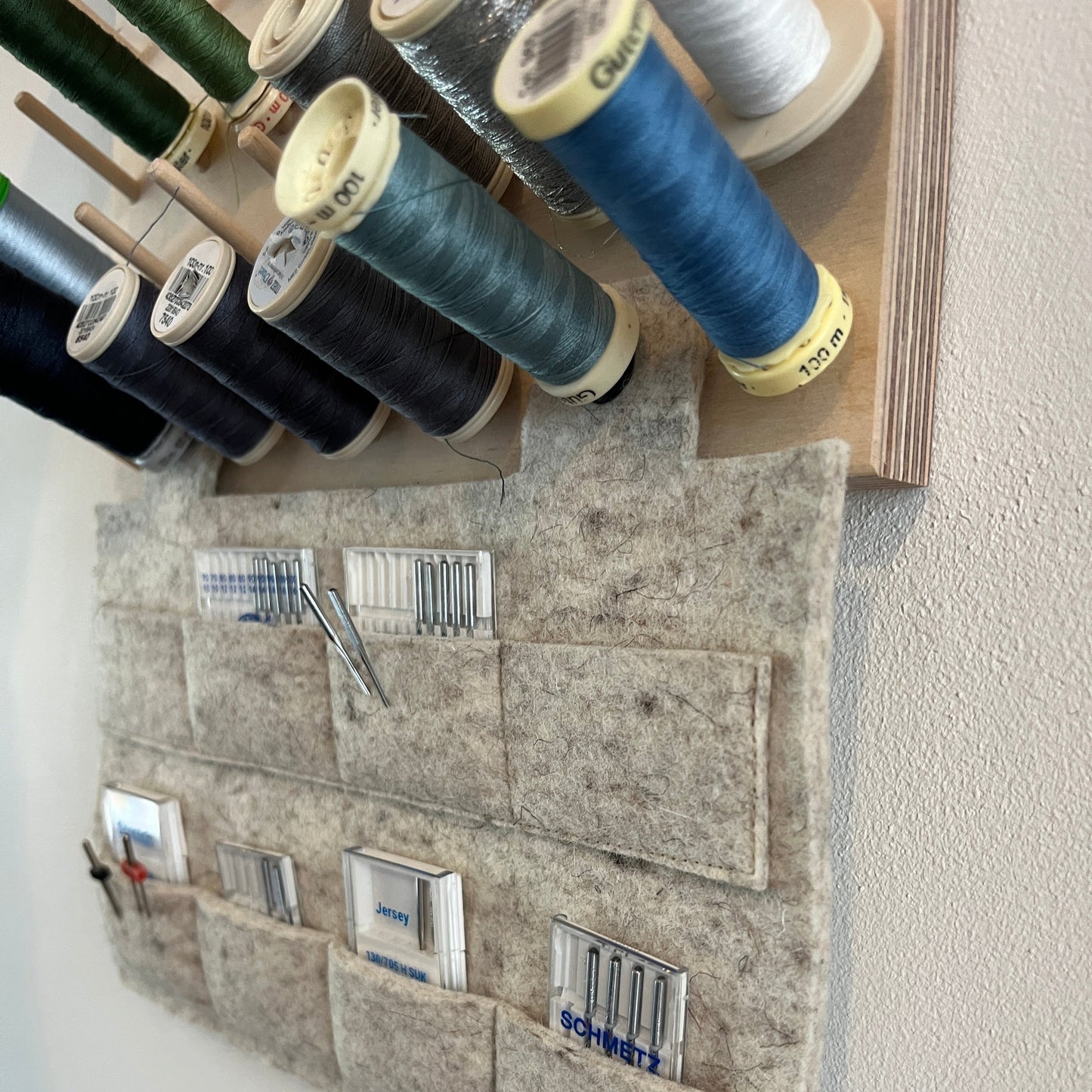 Pegboard with hanging needle storage