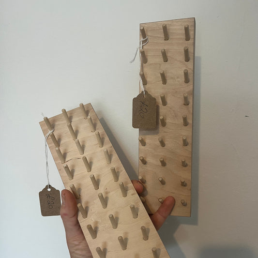 Two obbin holder pegboards