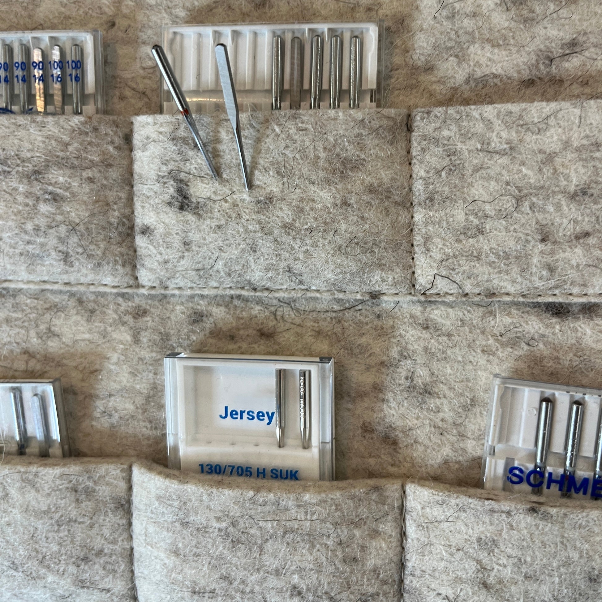 Close up of  sewing machine needle storage