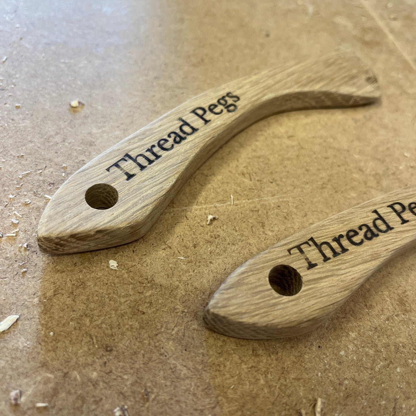 Wooden sewing tool on a textured surface