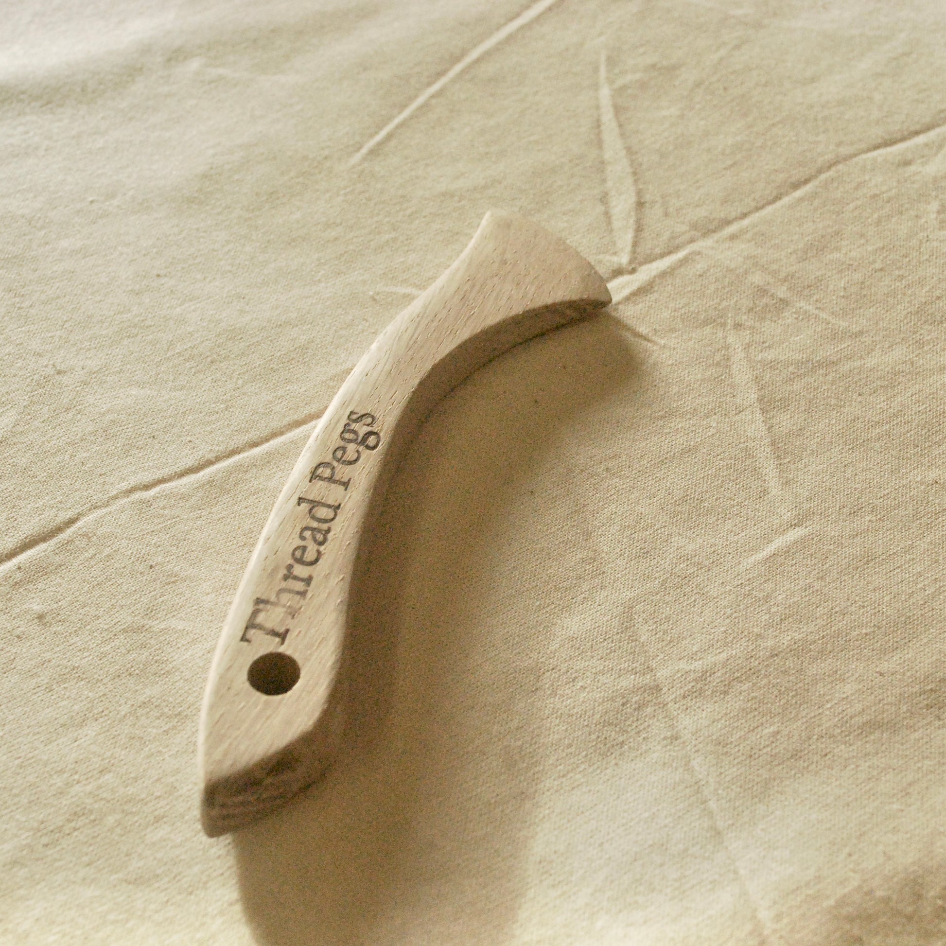 Hand made wood Hera Marker on fabric