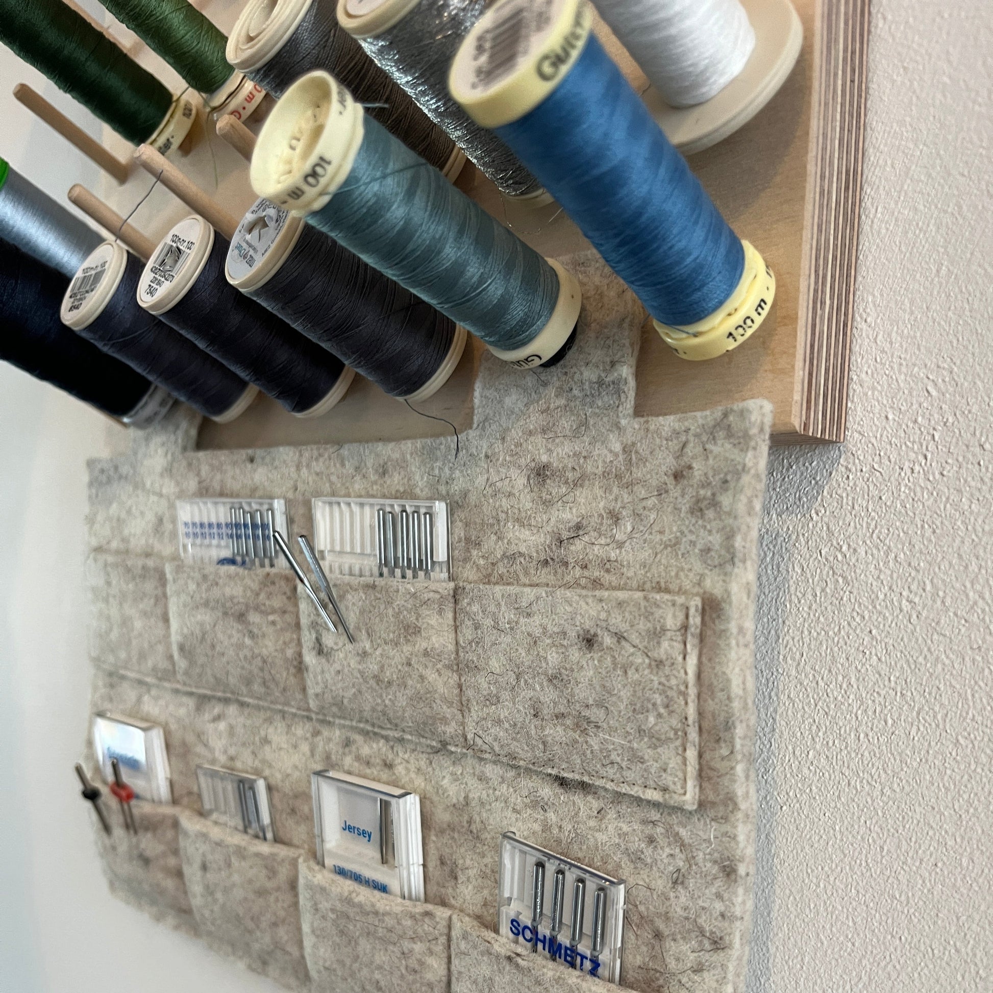 Pegboard with hanging needle storage