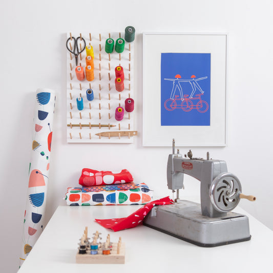 Sewing desk with cotton reel storage