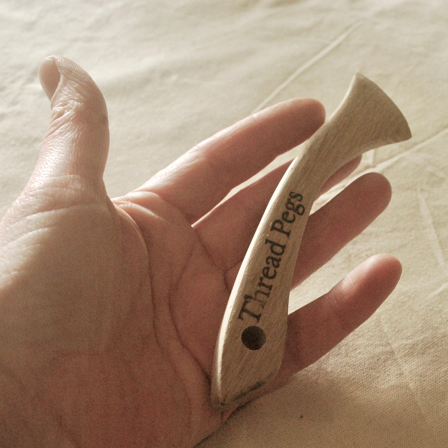 Sewing tool hand made from wood