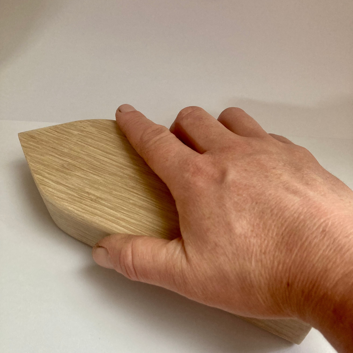 Tailor's clapper pressing tool in action 