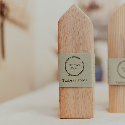 tailors clapper standing on ironing board